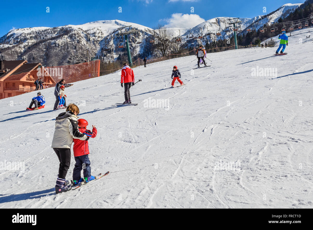 Child learning how to ski Stock Photo