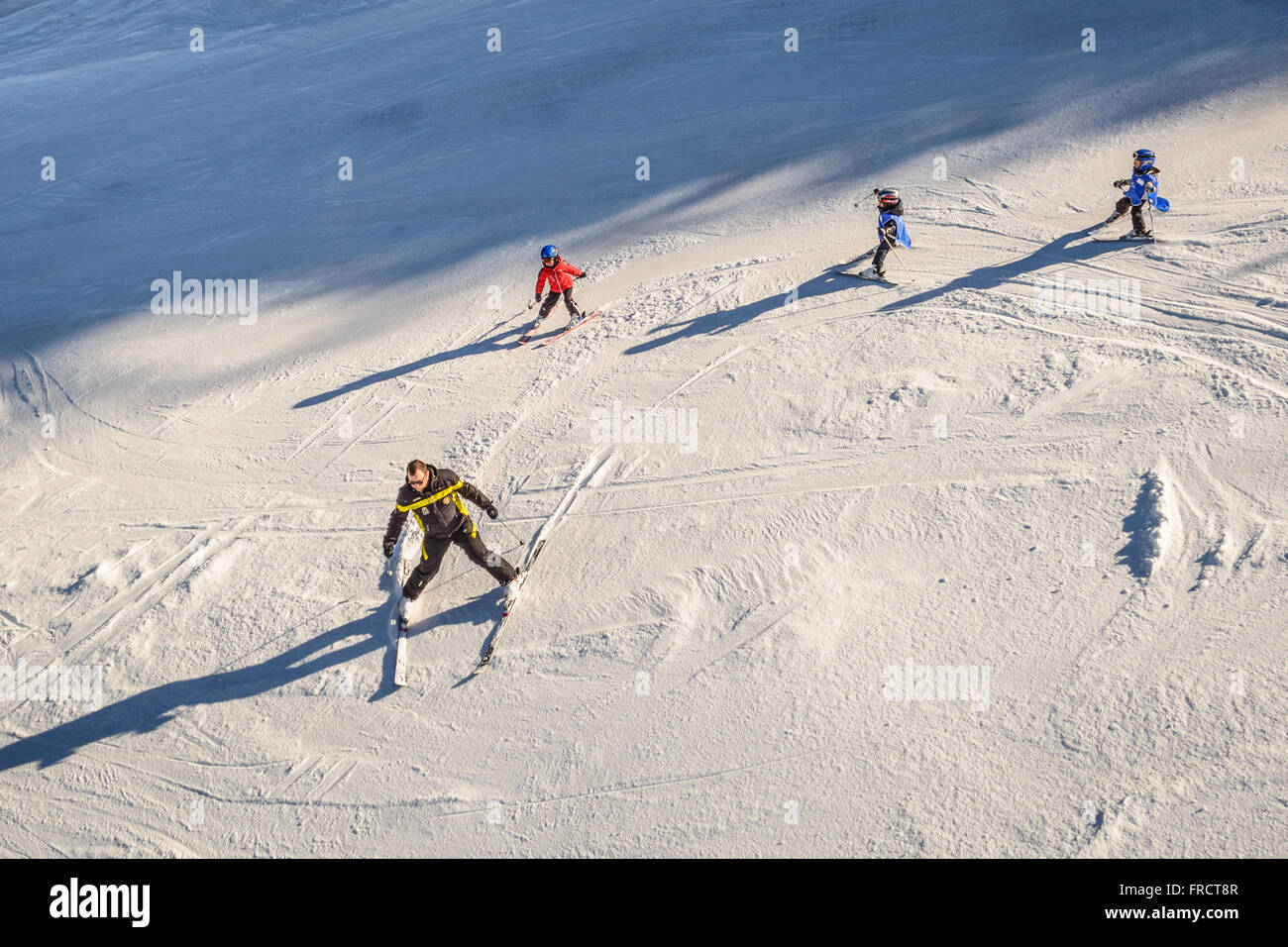 Children training ski in the Italian Alps Stock Photo