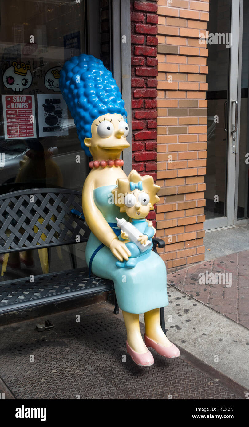 Plastic life-size model of Marge Simpson holding baby Maggie Simpson outside a Downtown restaurant in New York City Stock Photo