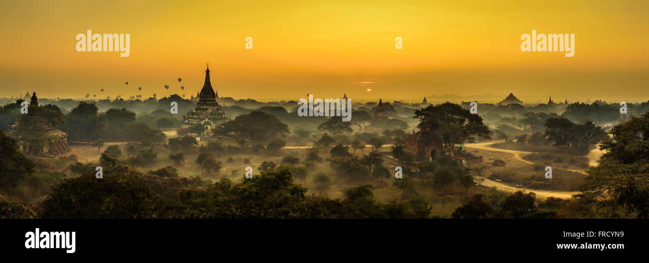 Scenic sunrise above Bagan in Myanmar. Bagan is an ancient city with thousands of historic buddhist temples and stupas. Stock Photo