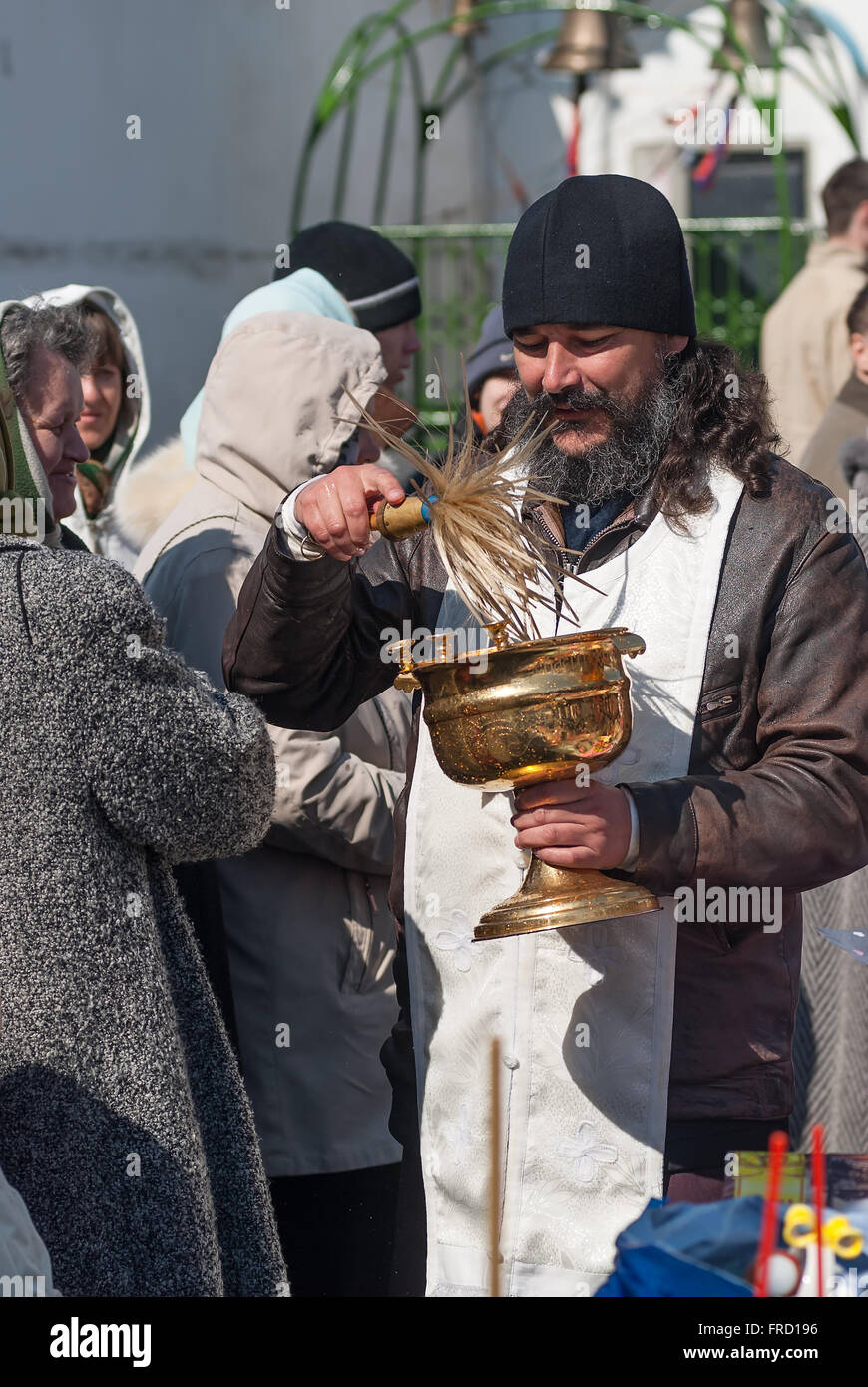 Priest blessing people with holy water. Tyumen Stock Photo Alamy