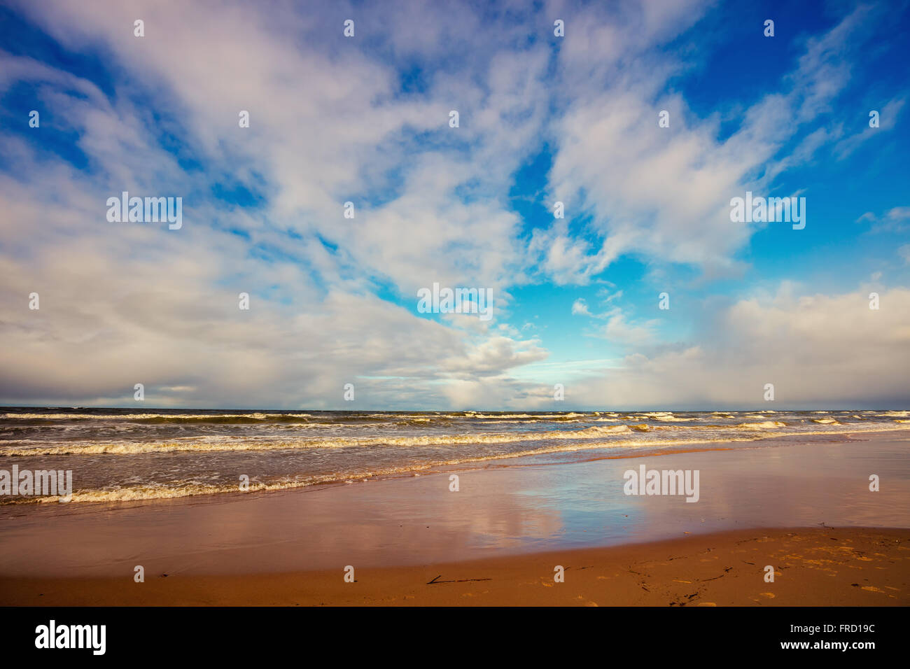 Sea shore with cloudy sky Stock Photo - Alamy