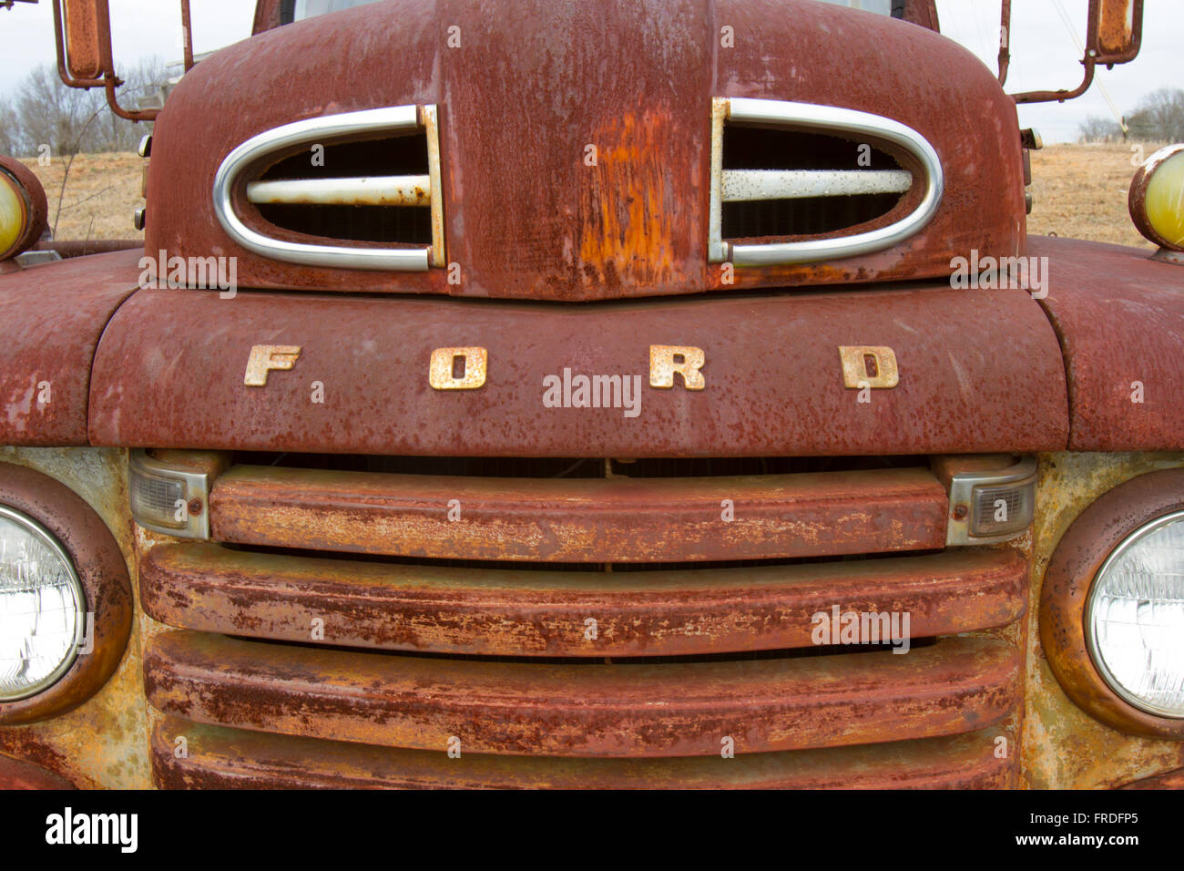 Columbia, VA, USA - March 12, 2016 :  Front grill of rusting Ford truck in field. Stock Photo