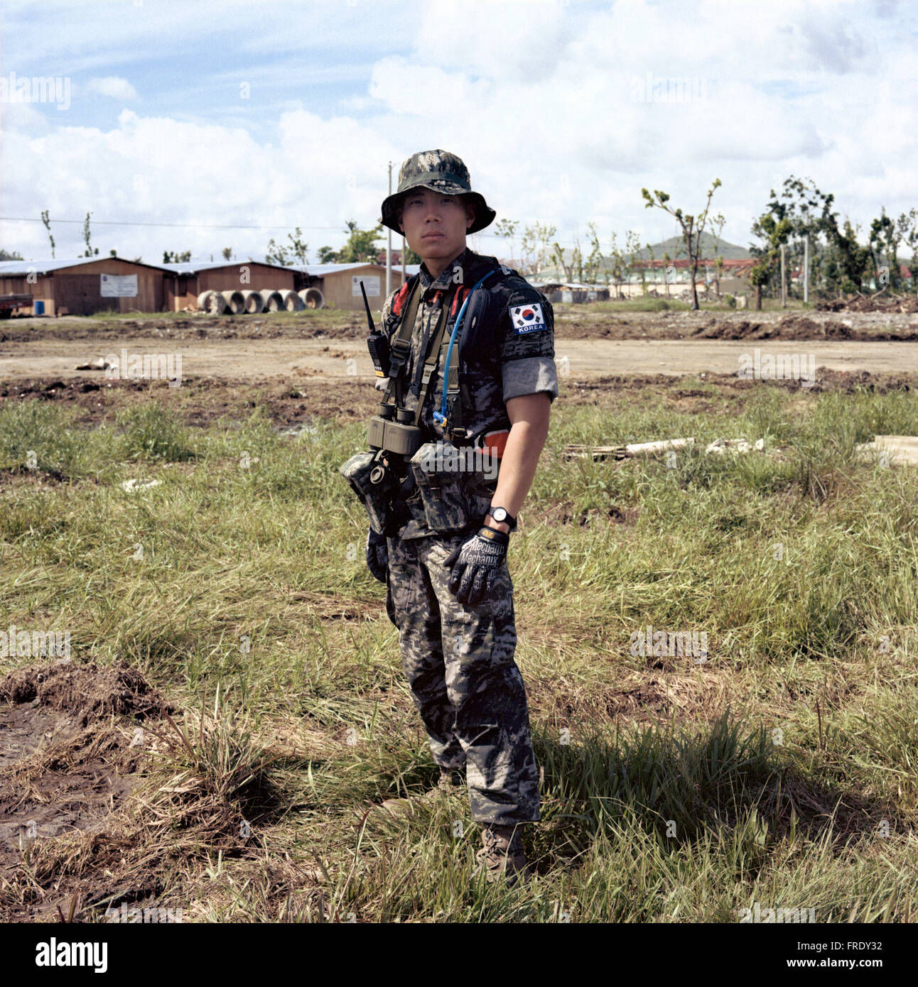 Tacloban; Leyte; Philippines - January 7, 2014: A Korean soldier is a member of the contingent taking part in rehabilitation. Stock Photo