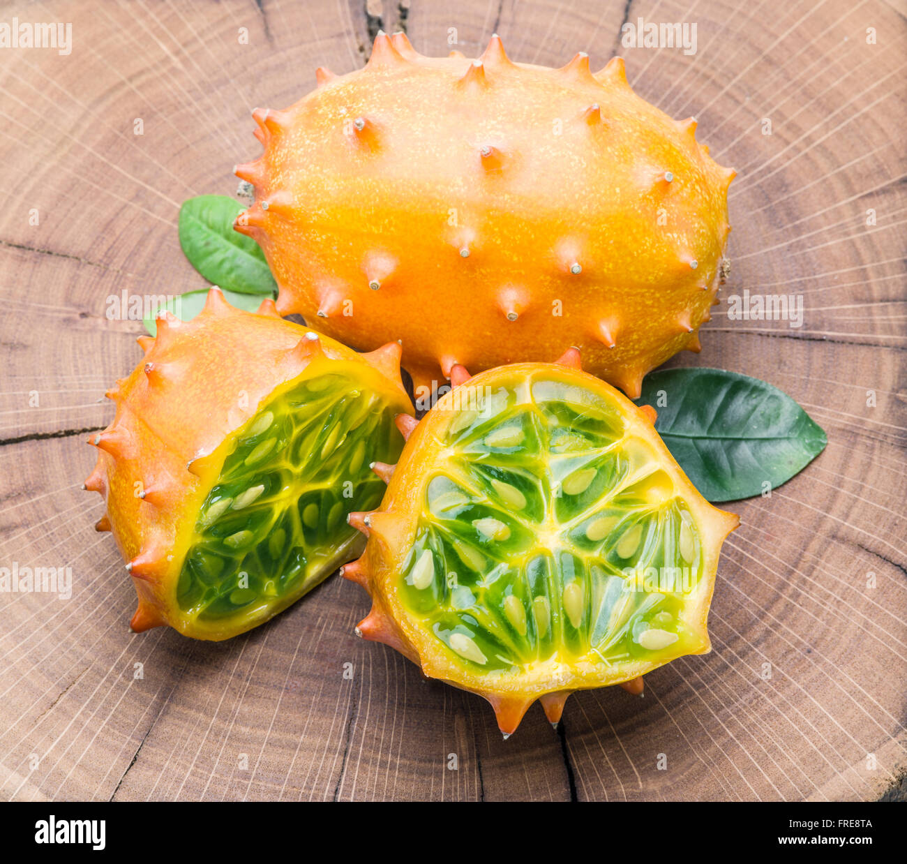 Kiwano fruits on the wooden table. Stock Photo