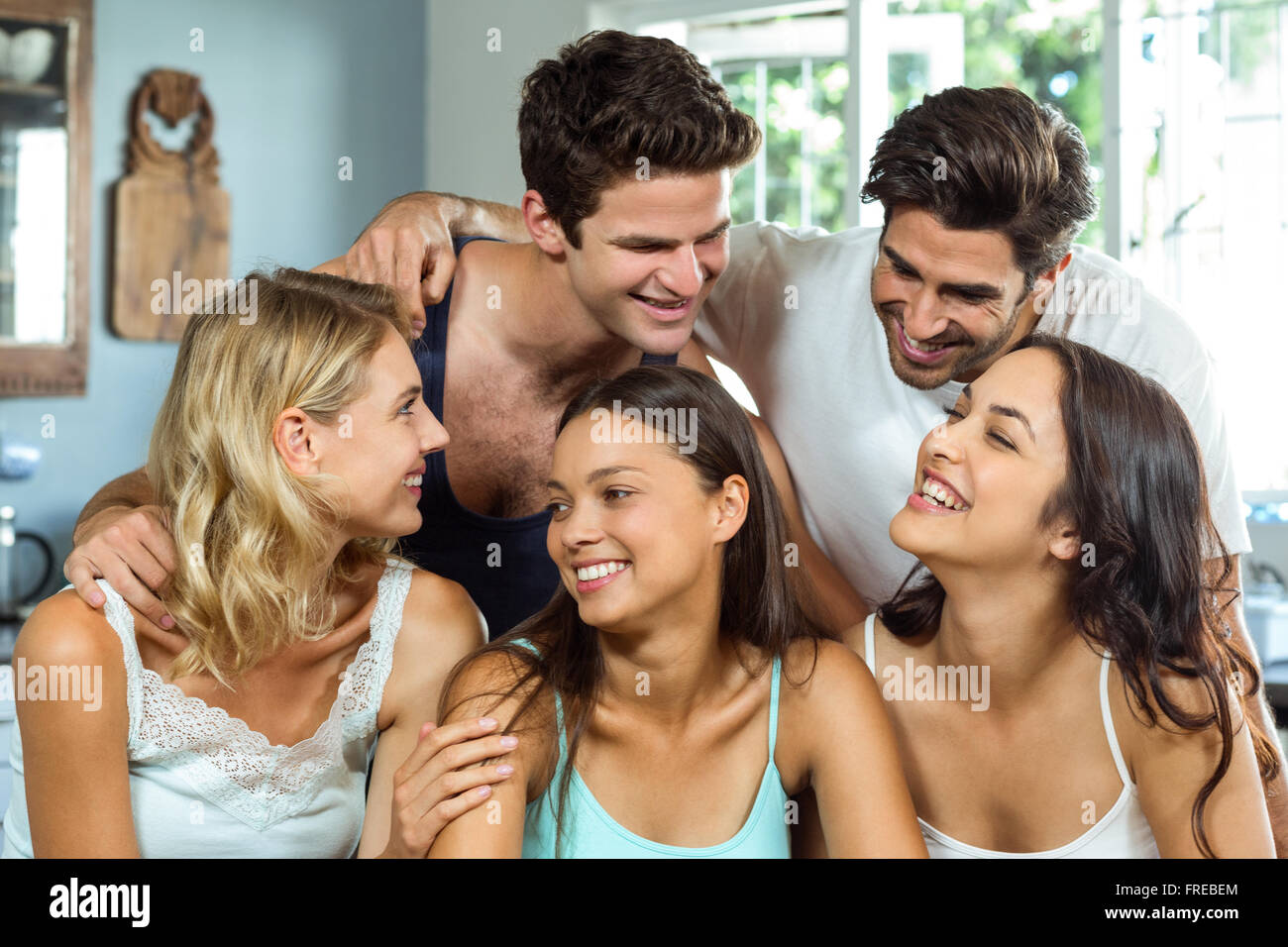 Young friends spending leisure time at home Stock Photo