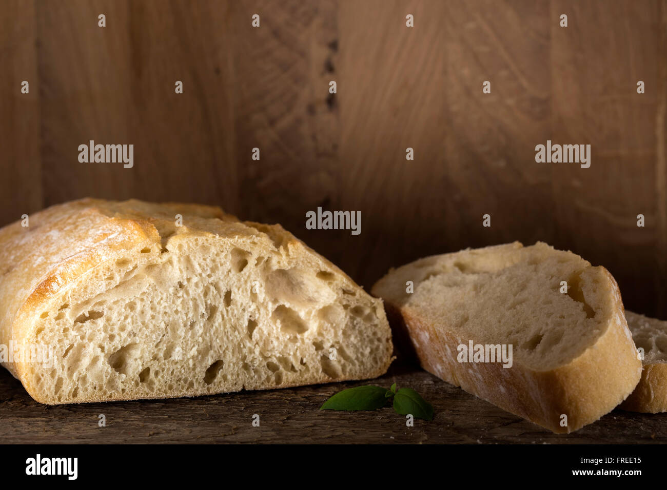 Sliced bread on a wooden background with copy space Stock Photo