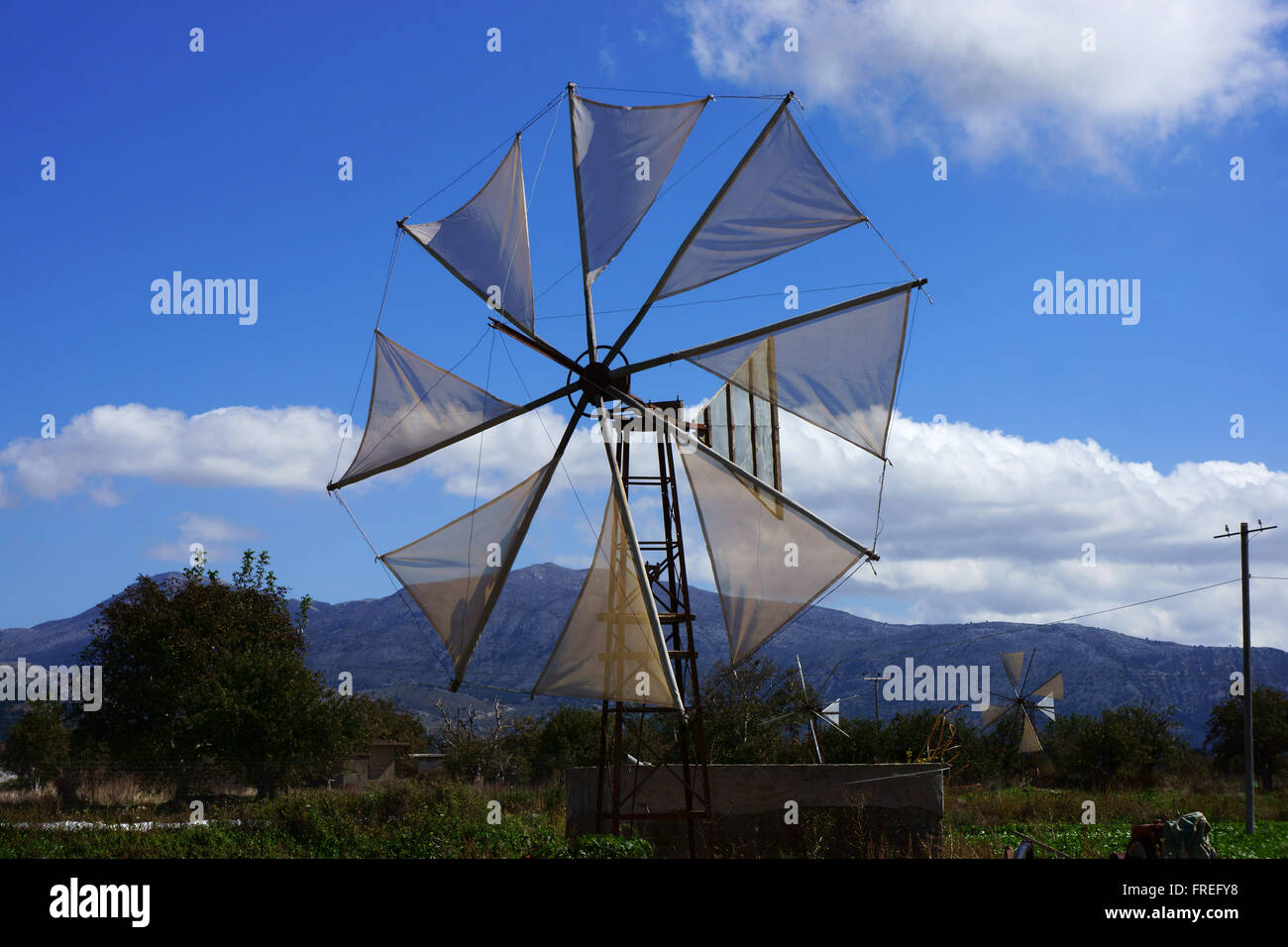 Windmills on Lassithi plateau, island Crete, Greece Stock Photo