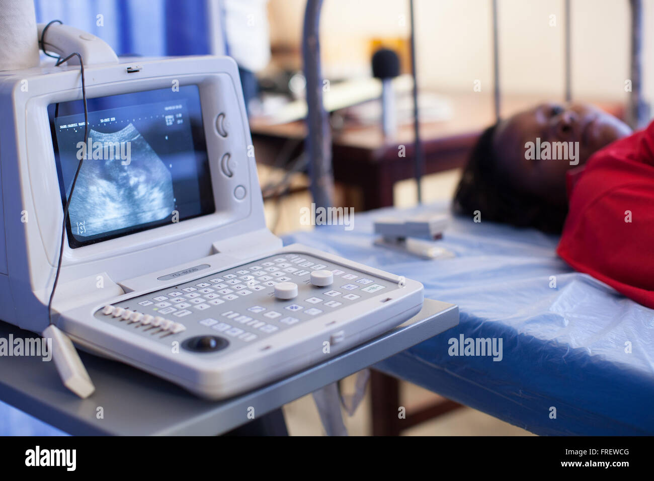 A pregnant woman having an ultrasound scan at Kasangati Health Centre in Uganda, Africa Stock Photo