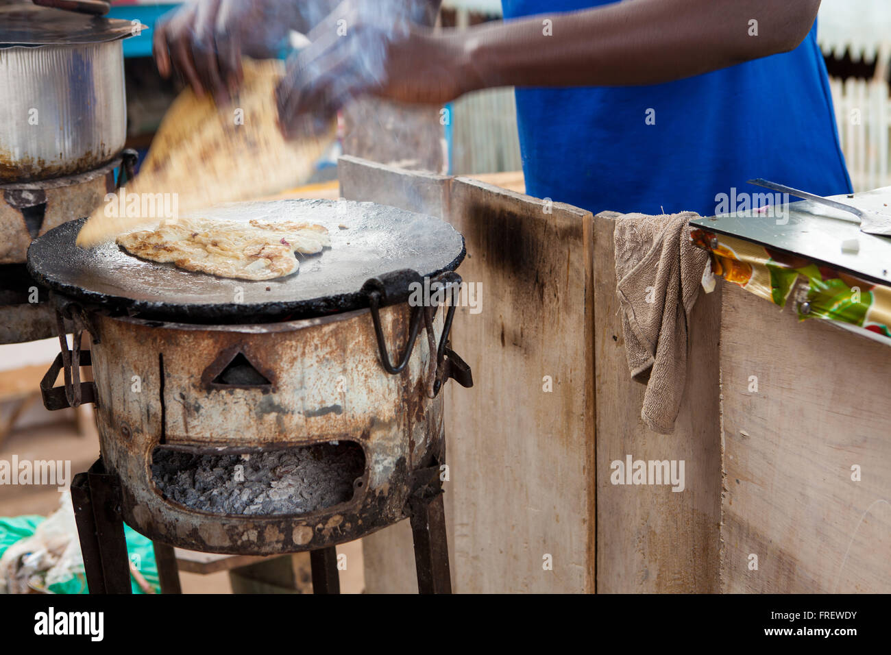 Chapatis being cooked on a stove, Uganda Africa Stock Photo