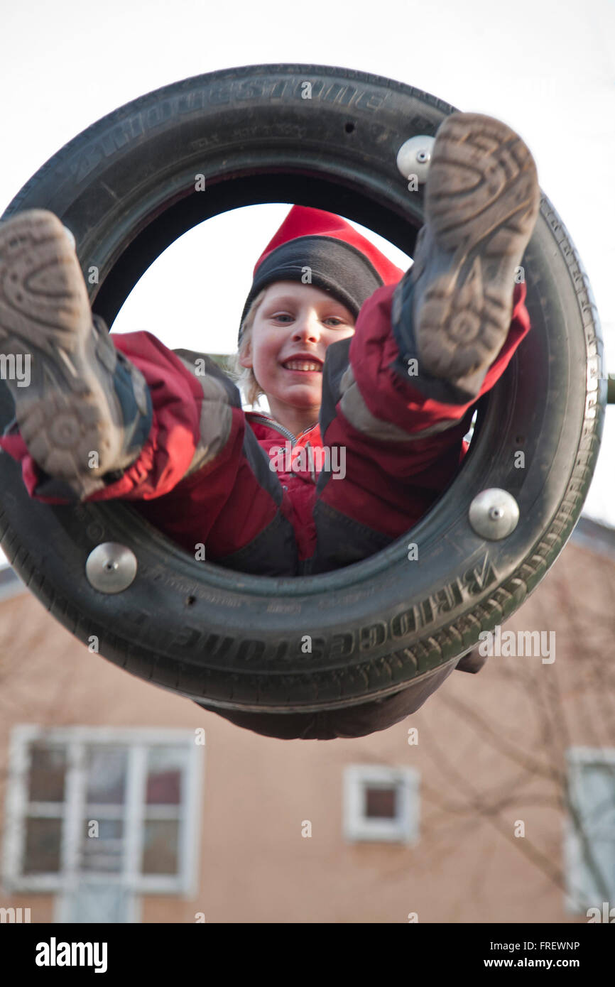 A swinging boy Stock Photo Alamy