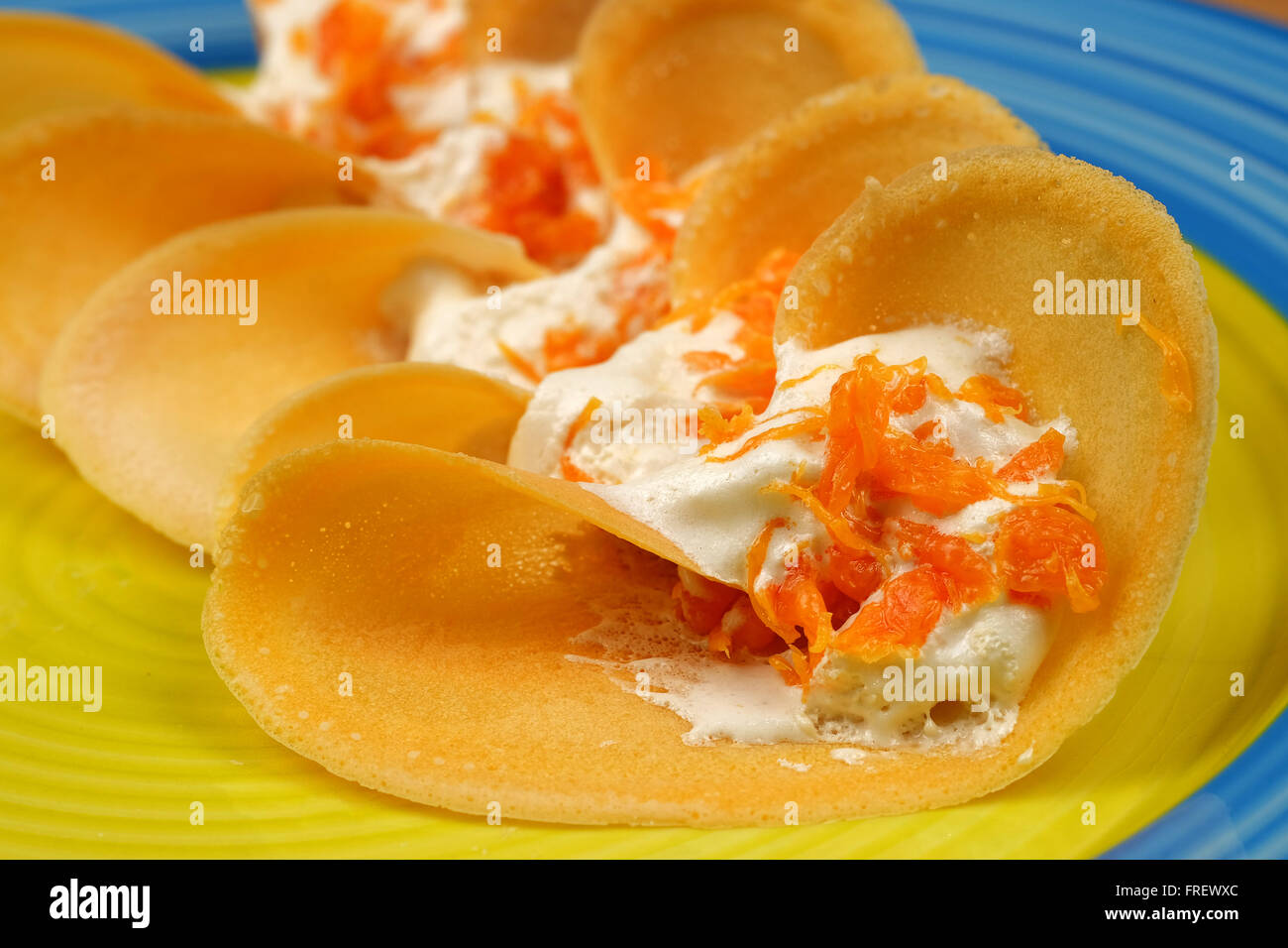 Khanom Beaung Thai or a kind of filled pancake Thai food or Thai Style Crisp Tart on tray, Thailand - (Selective focus) Stock Photo