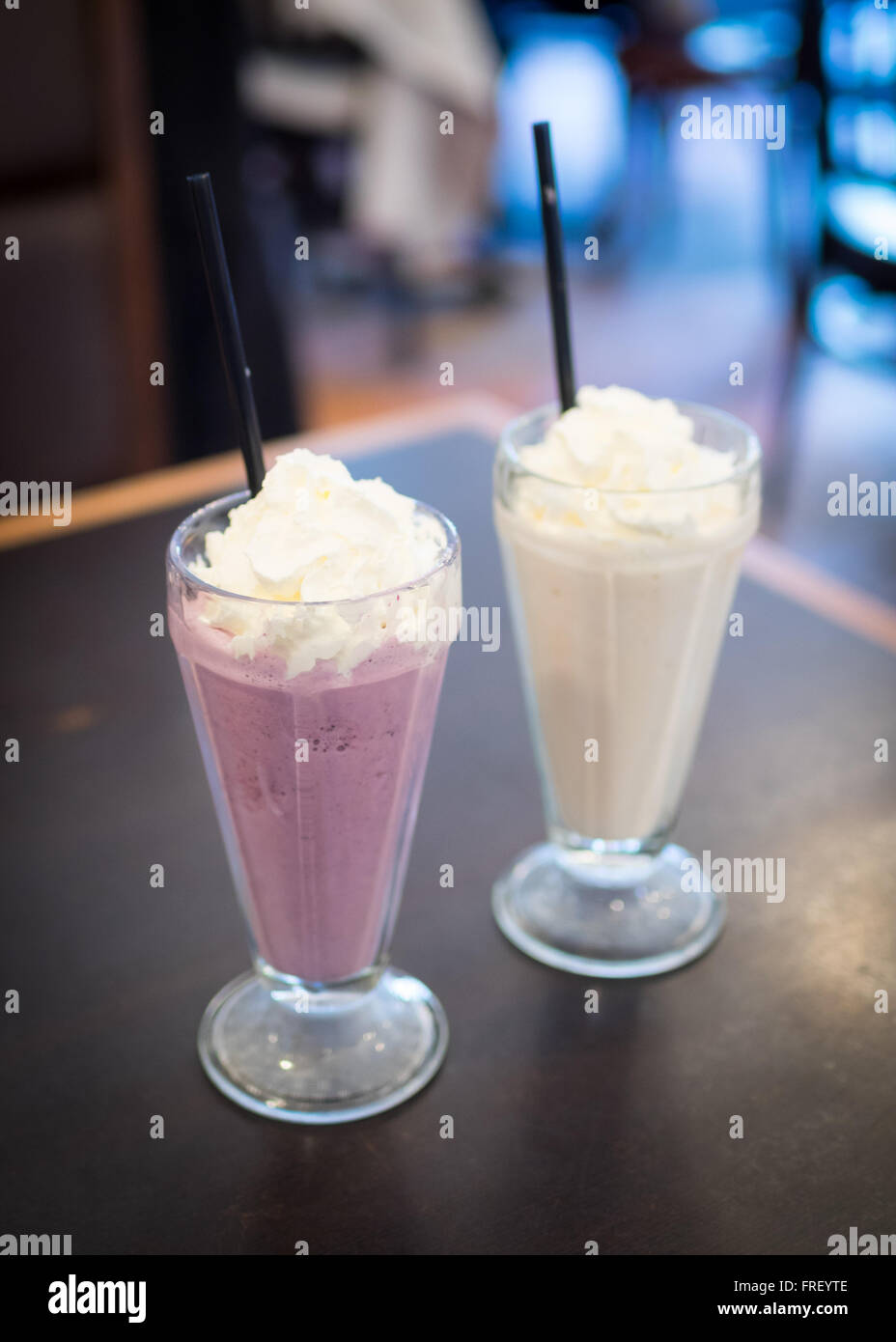 A mixed berry milkshake and chai tea milkshake from Urban Diner in Edmonton, Alberta, Canada. Stock Photo