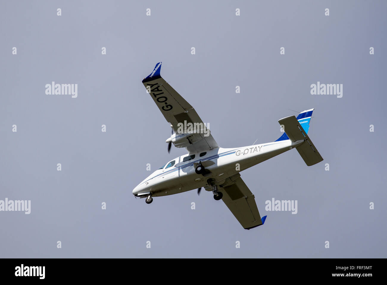 Tayside Aviation G-OTAY Tecnam P-2006T twin-engine aircraft flying overhead preparing to land at the Dundee airport, UK Stock Photo