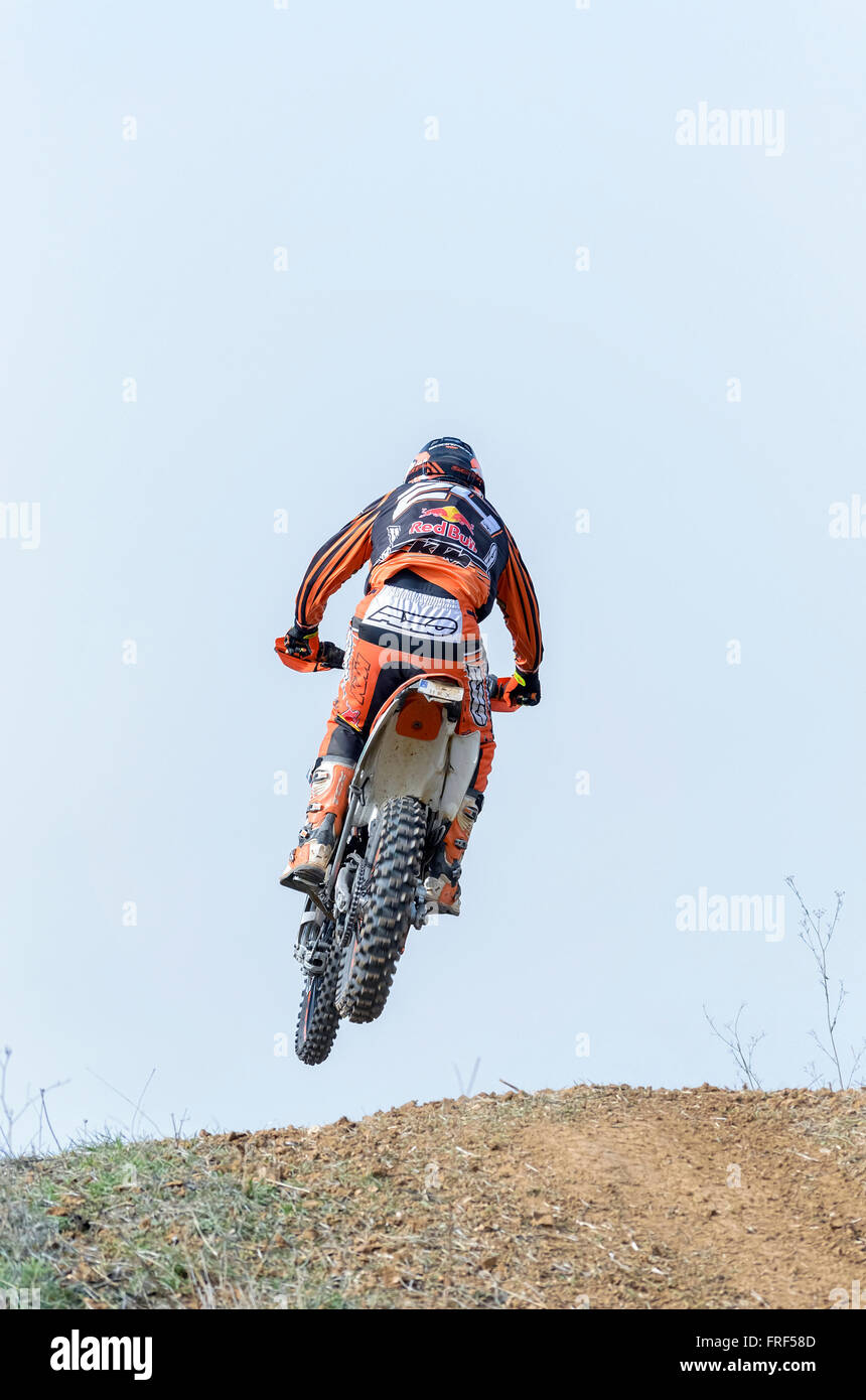 Spain cross country championship. Back view of motorcyclist when he is jumping with his motocross motorbike. Stock Photo