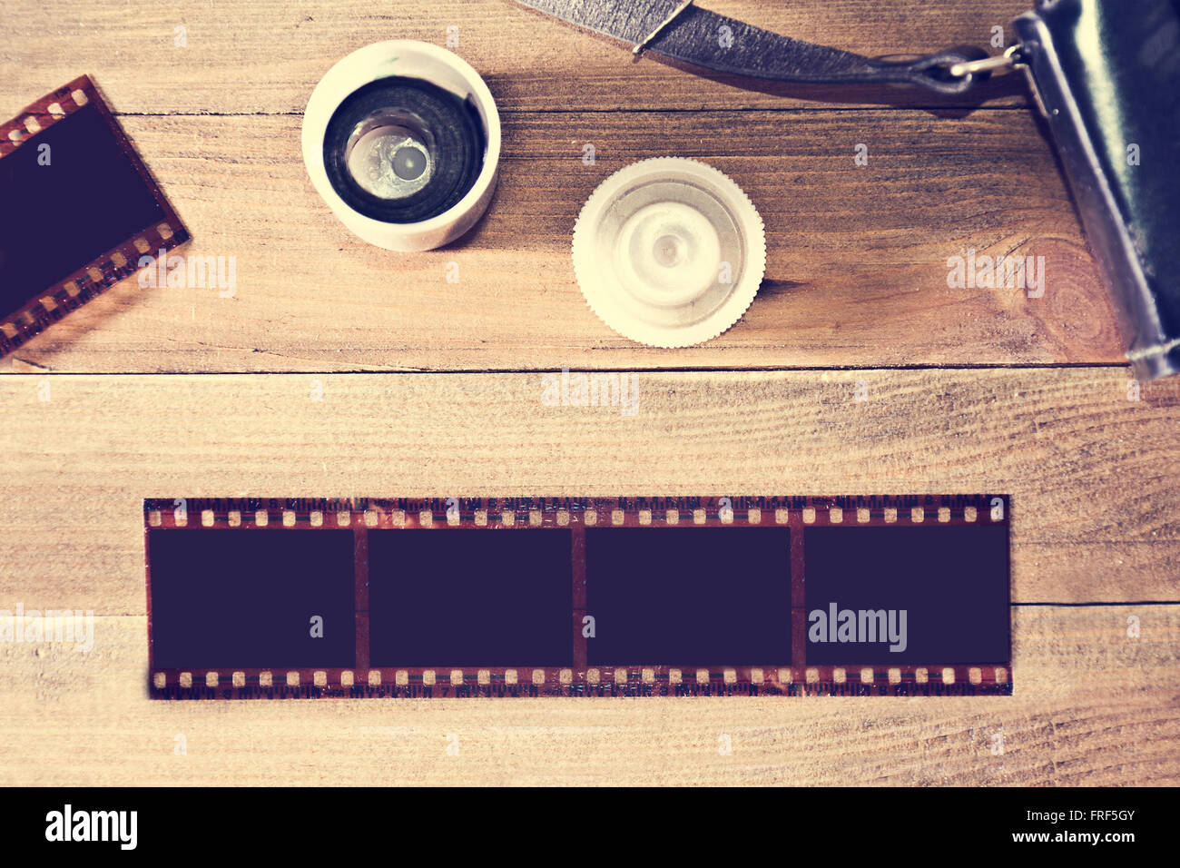 Photographic film on wooden background. Instagram retro vintage picture Stock Photo - Alamy
