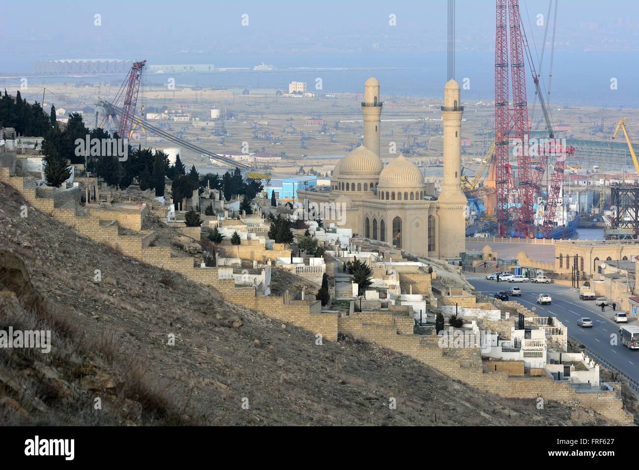 Bibi-heybat Mosque, with the shipyard, Bayil oil field and graveyard. Azerbaijan's most significant mosque, on the Caspian coast Stock Photo