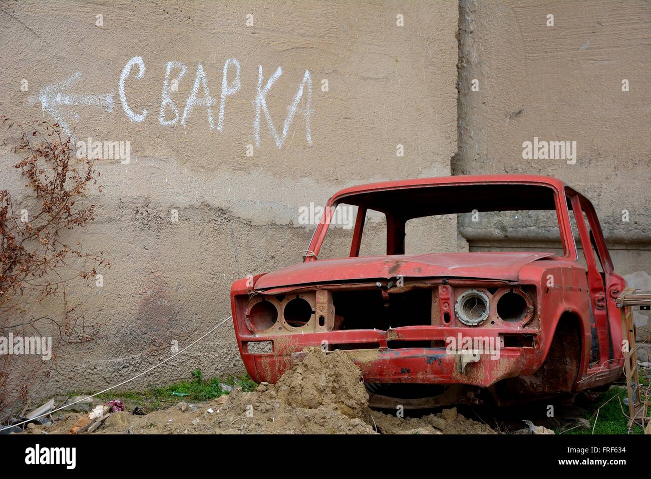 Welding sign with body of old car in foreground. An advertisement of sorts for a welding shop in the northern suburbs of Baku Stock Photo