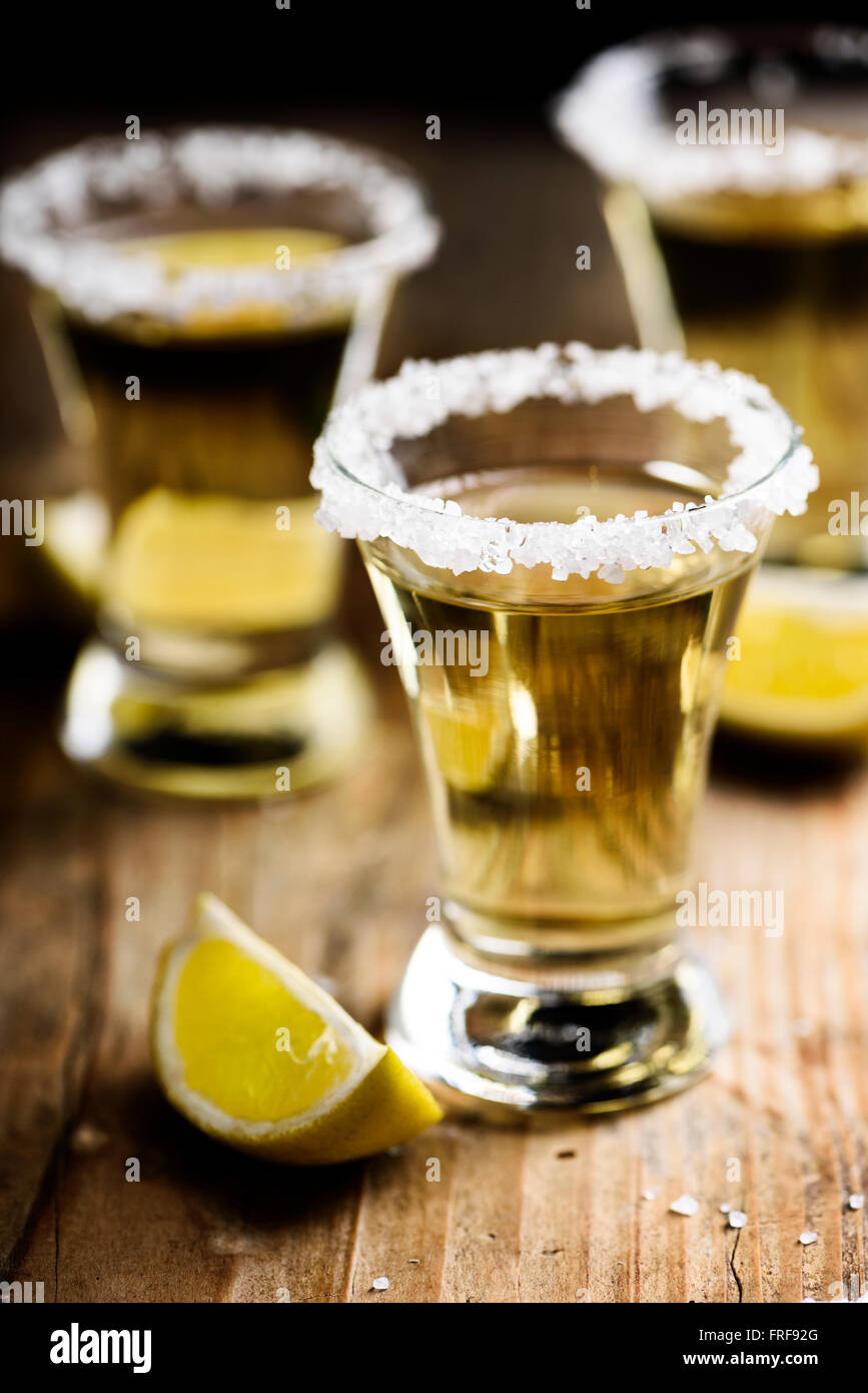 Tequila shots with salt on wooden table Stock Photo Alamy