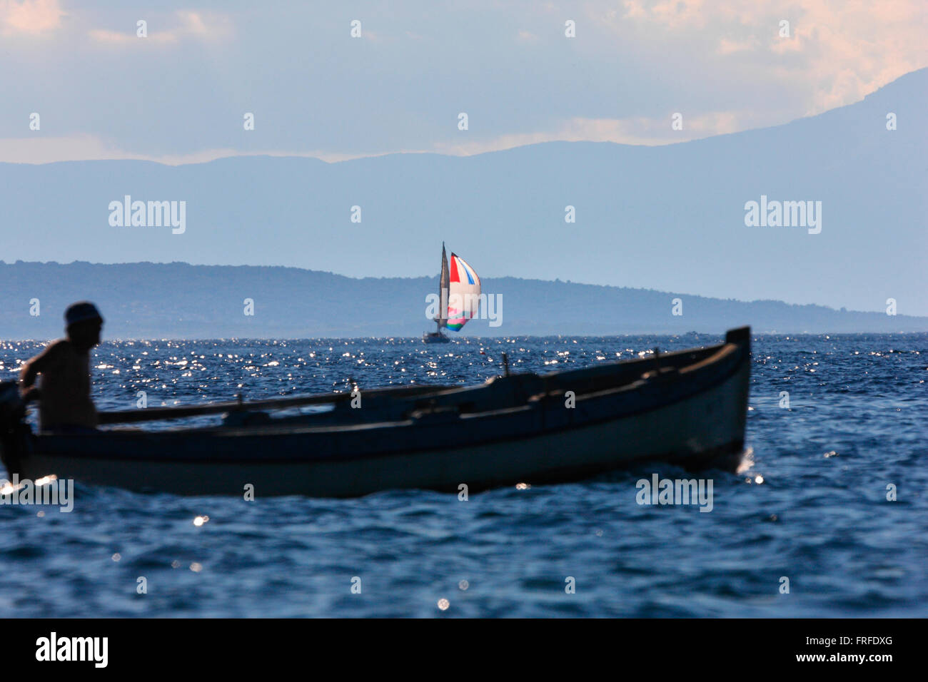 Sailing in Mediterranean, Croatia, Fisherman's boat in front and sailboat on the back Stock Photo