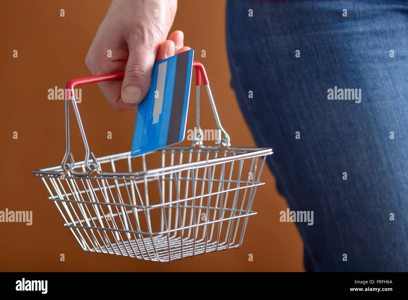 Online shopping with shopping basket and credit card Stock Photo