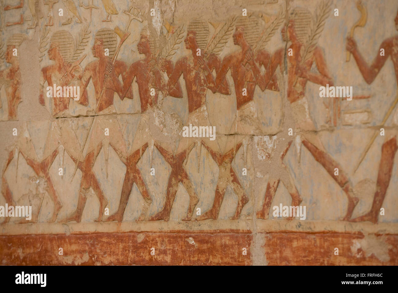 A detail of ancient Egyptian hieroglyphs showing Somalian slaves at the ancient Egyptian Temple of Hatshepsut near the Valley of the Kings, Luxor, Nile Valley, Egypt. The Mortuary Temple of Queen Hatshepsut, the Djeser-Djeseru, is located beneath cliffs at Deir el Bahari ('the Northern Monastery'). The mortuary temple is dedicated to the sun god Amon-Ra and is considered one of the 'incomparable monuments of ancient Egypt.' The temple was the site of the massacre of 62 people, mostly tourists, by Islamists on 17 November 1997. Stock Photo