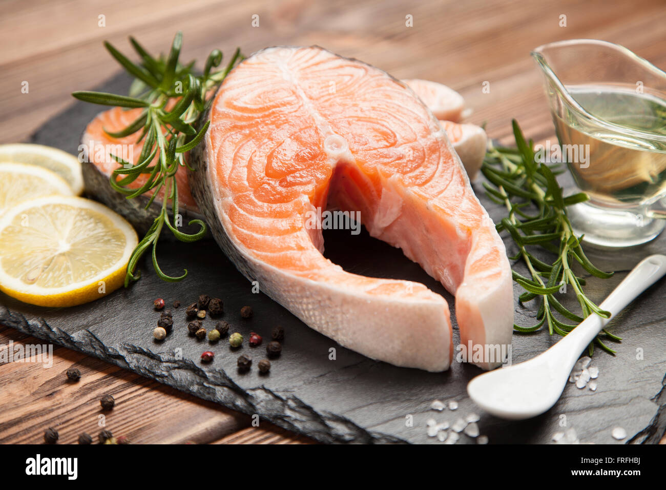 Fresh salmon on old wood Stock Photo - Alamy