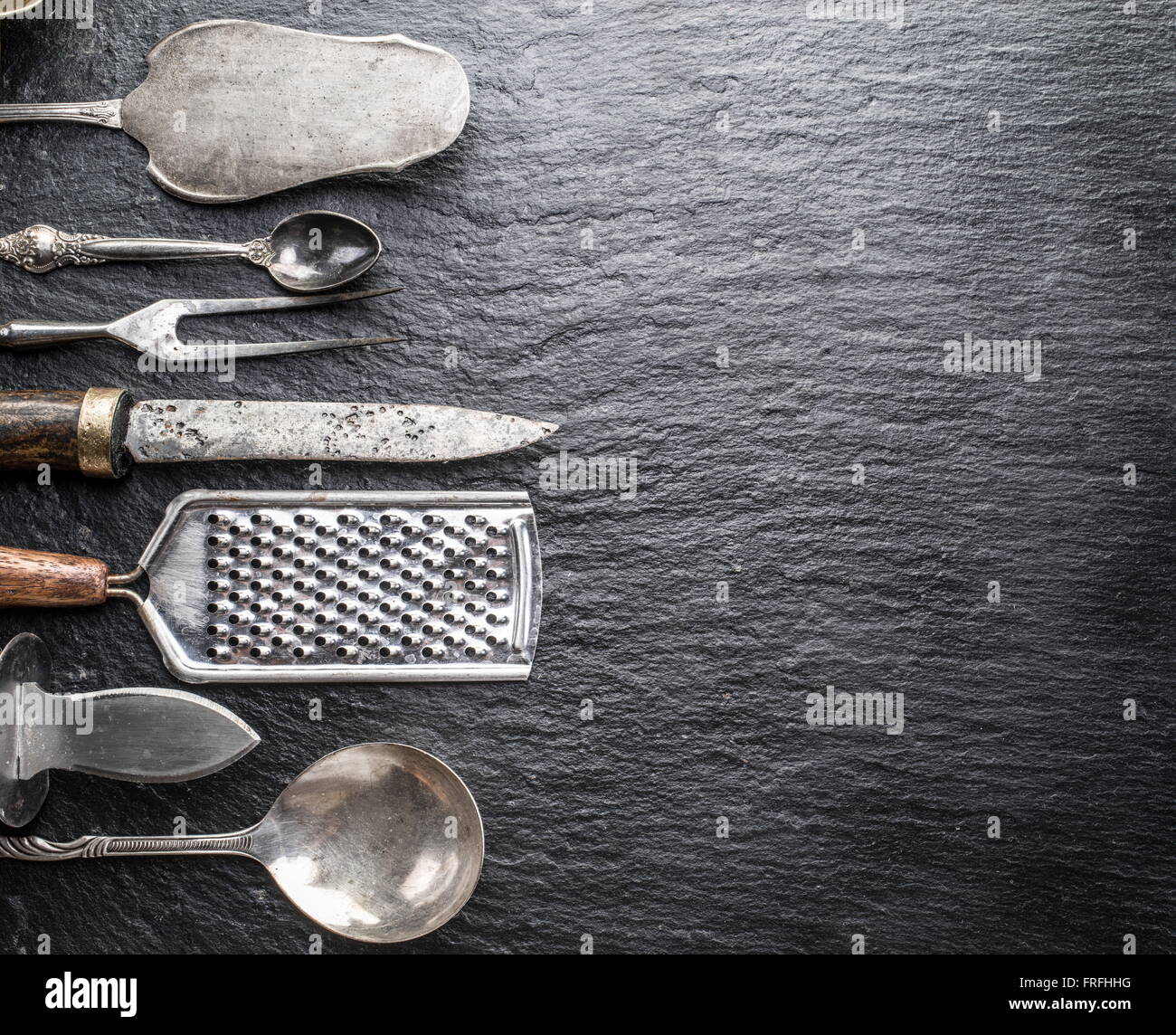 Kitchen utensils on the graphite background Stock Photo Alamy
