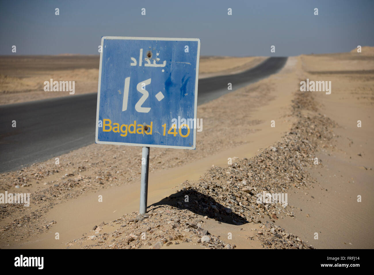A desert highway road sign for the Egyptian town of Bagdad (not to be