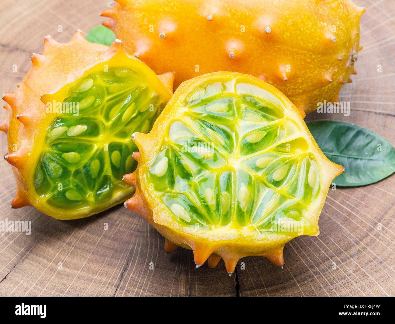 Kiwano fruits on the wooden table. Stock Photo