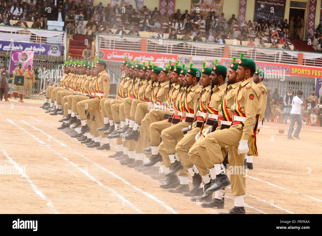 Balochistan, Pakistan. 22nd Mar, 2016. Army personal are presenting the parade on front of the stage during the opening ceremony of Balochistan Sports Festival 2016 On the occasion of Pakistan Day. Organized by Government of Balochistan in collaboration with Pakistan Army. Credit:  Din Muhammad Watanpaal/Alamy Live News Stock Photo