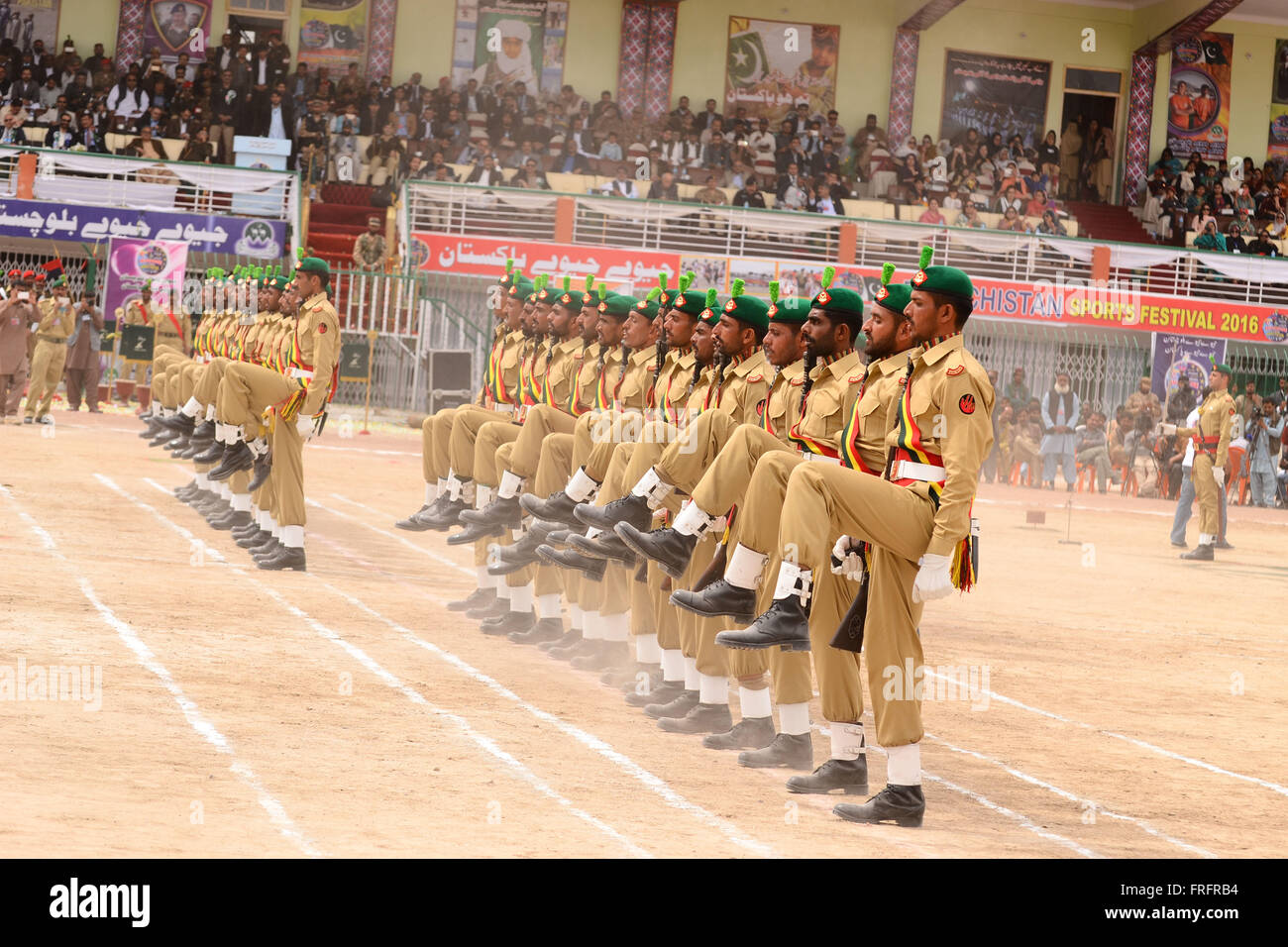 Balochistan, Pakistan. 22nd Mar, 2016. Army personal are presenting the parade on front of the stage during the opening ceremony of Balochistan Sports Festival 2016 On the occasion of Pakistan Day. Organized by Government of Balochistan in collaboration with Pakistan Army. Credit:  Din Muhammad Watanpaal/Alamy Live News Stock Photo