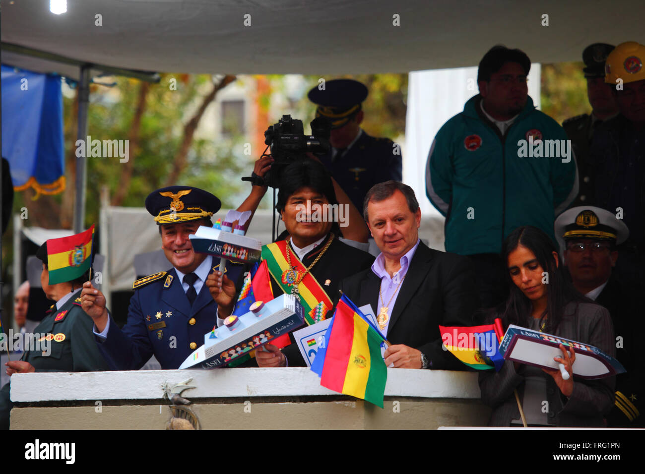La Paz, Bolivia - March 22 2016: Bolivian President Evo Morales (centre) holds a model ship as hes watches military parades during events to commemorate the Day of the Sea / Dia del Mar. To his right is the President of the Senate Juan Alberto 'Gringo' Gonzales. Every year on March 23rd Bolivia celebrates the Day of the Sea, a patriotic event to remember the loss of its coastal Litoral Province as a result of the War of the Pacific with Chile. Credit:  James Brunker / Alamy Live News Stock Photo