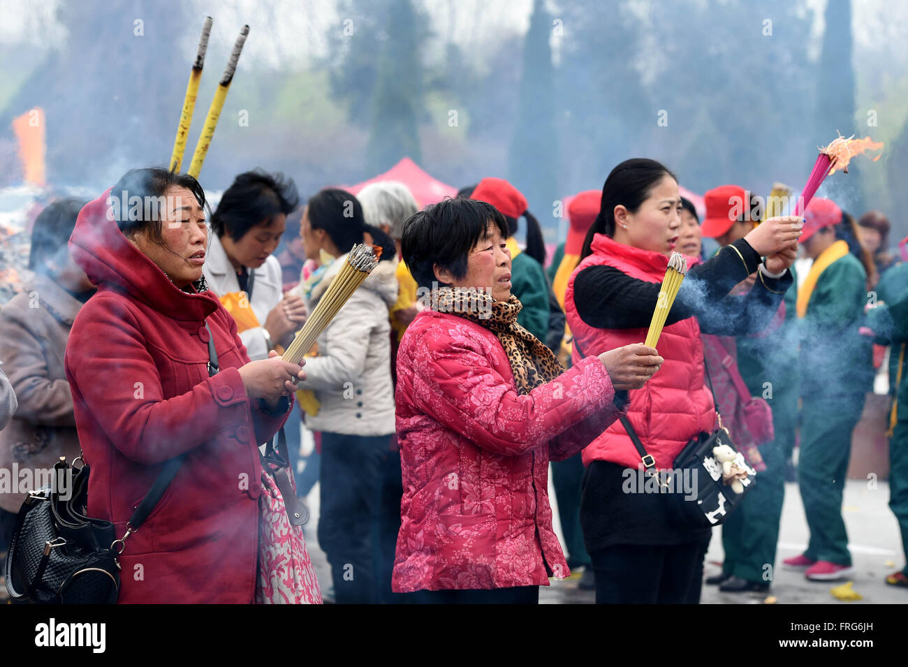 Luyi, China's Henan Province. 23rd Mar, 2016. People worship Laozi (or Lao-tzu, Lao-tse 604-531 BC) during a memorial ceremony for Laozi 2,587th birth anniversary at Taiqing Palace in Luyi County, central China's Henan Province, March 23, 2016. Laozi, best known as the author of the Tao Te Ching, is traditionally considered as the founder of Taoism. © Li Bo/Xinhua/Alamy Live News Stock Photo
