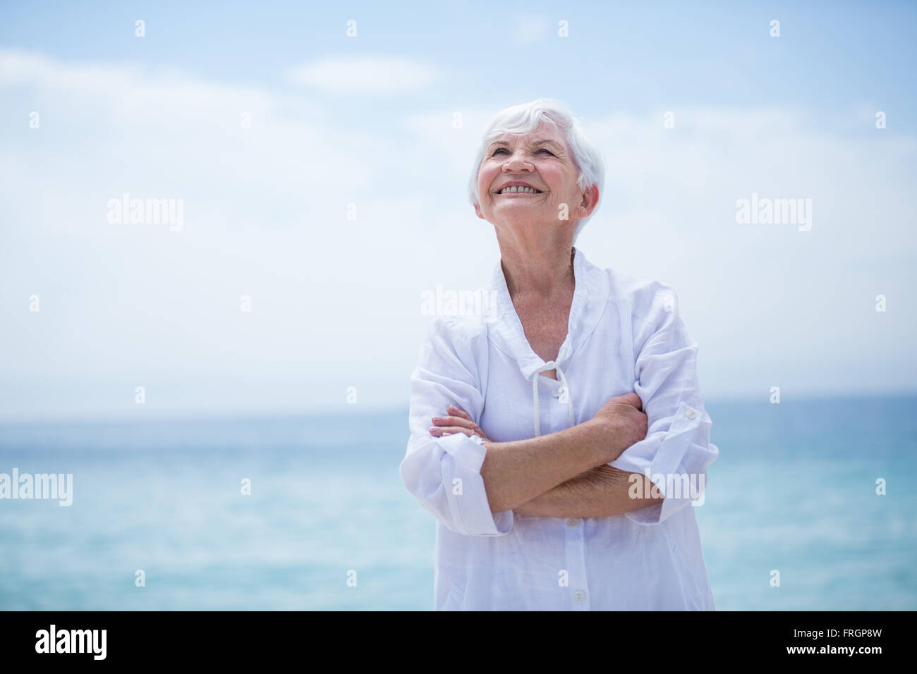 Woman arms up looking sky hi-res stock photography and images - Alamy