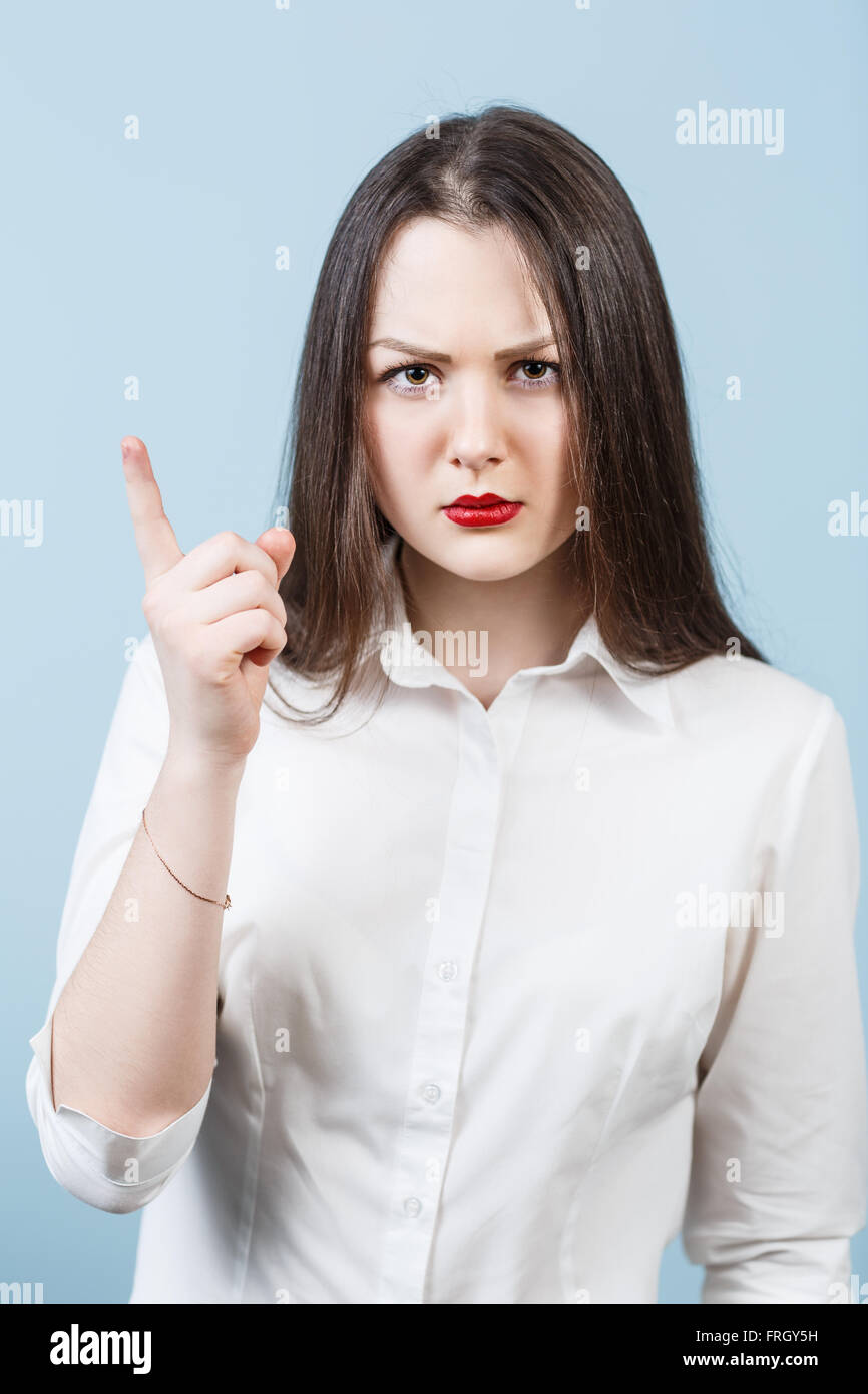 Young angry woman threaten finger Stock Photo