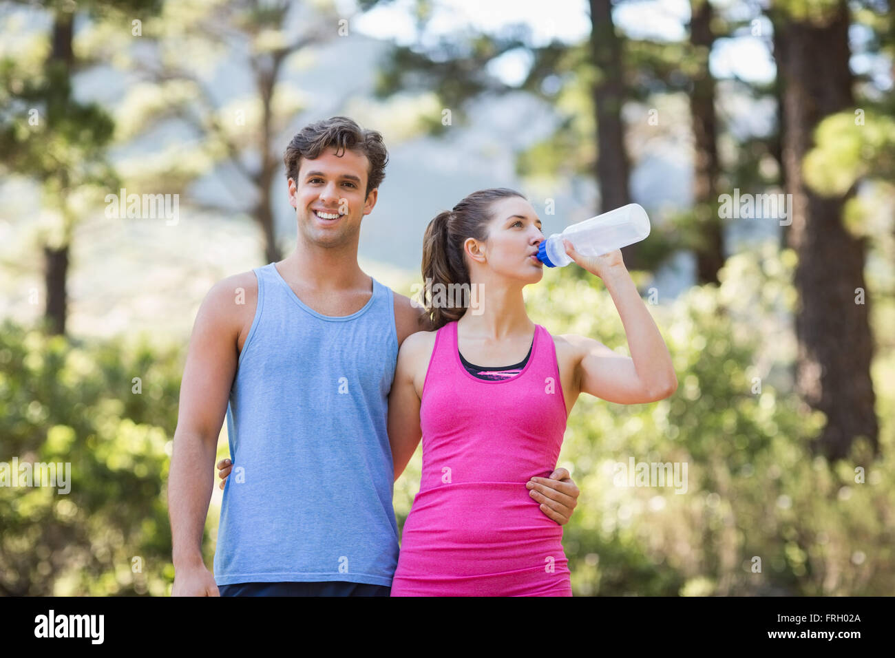 Portrait of man with partner drinking water i Stock Photo