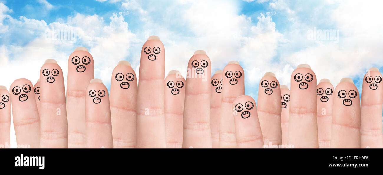 Many fingers with drawn faces Stock Photo