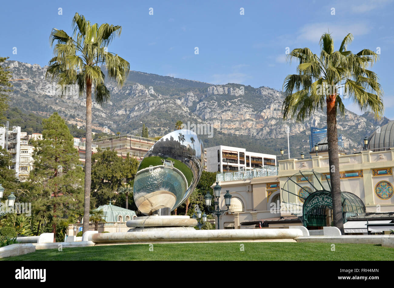 An Anish Kapoor sky mirror outside of the Casino Monte Carlo in Monaco, France with the Café de Paris in the background Stock Photo