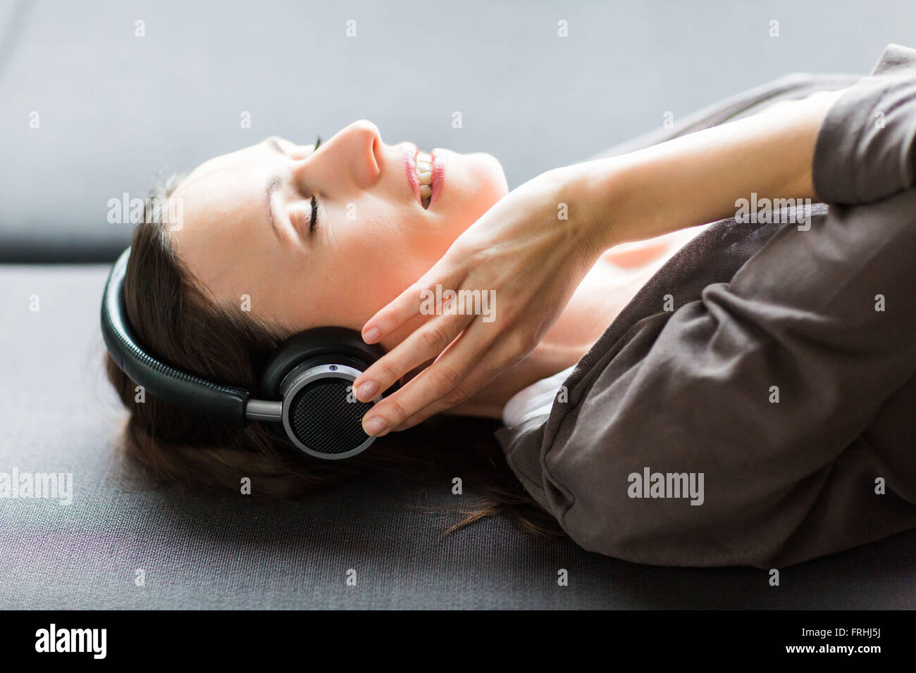 Woman using headphones. Stock Photo
