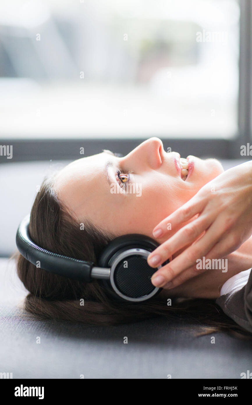 Woman using headphones. Stock Photo