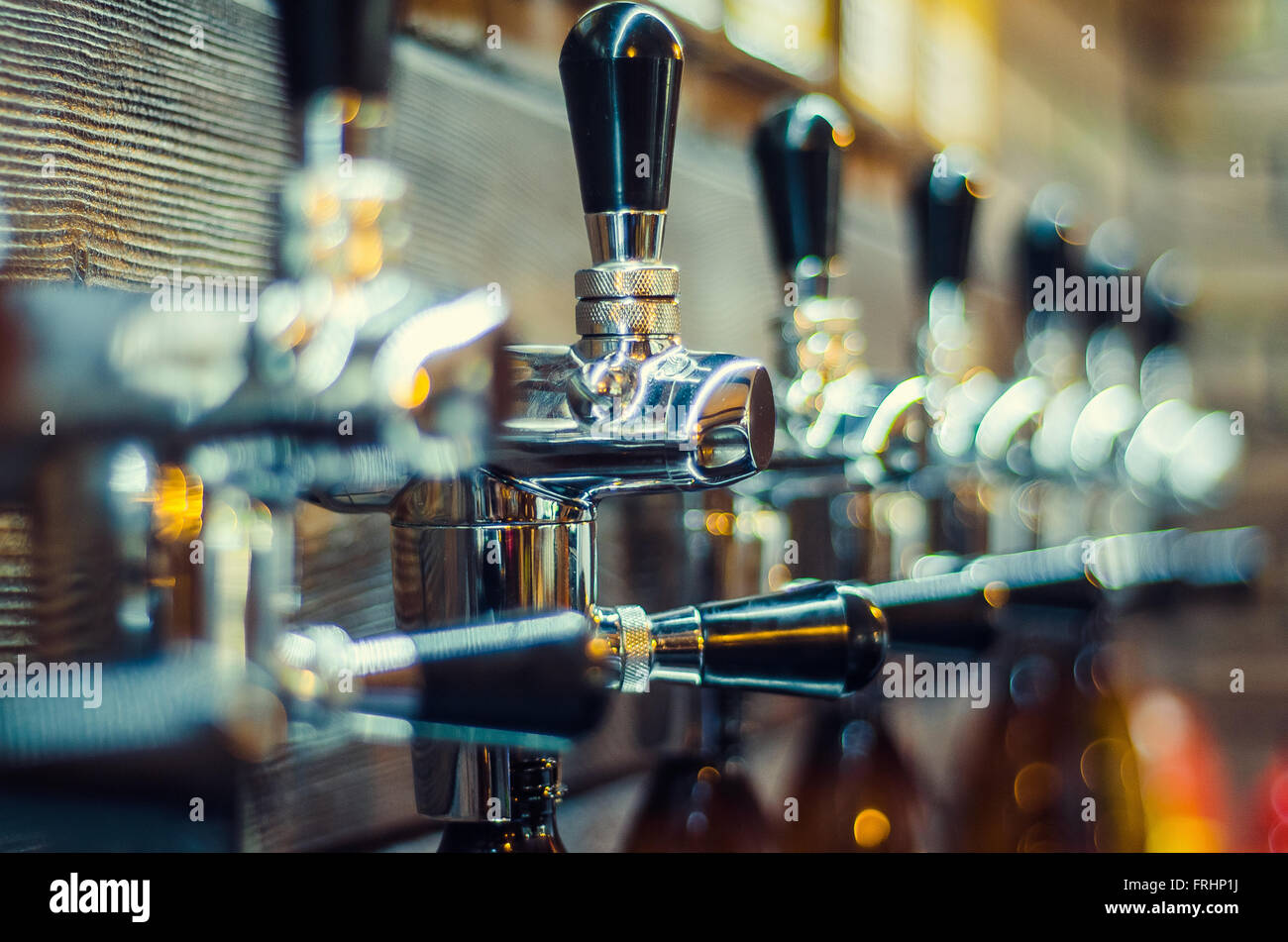 valves for filling beer bottles Stock Photo Alamy
