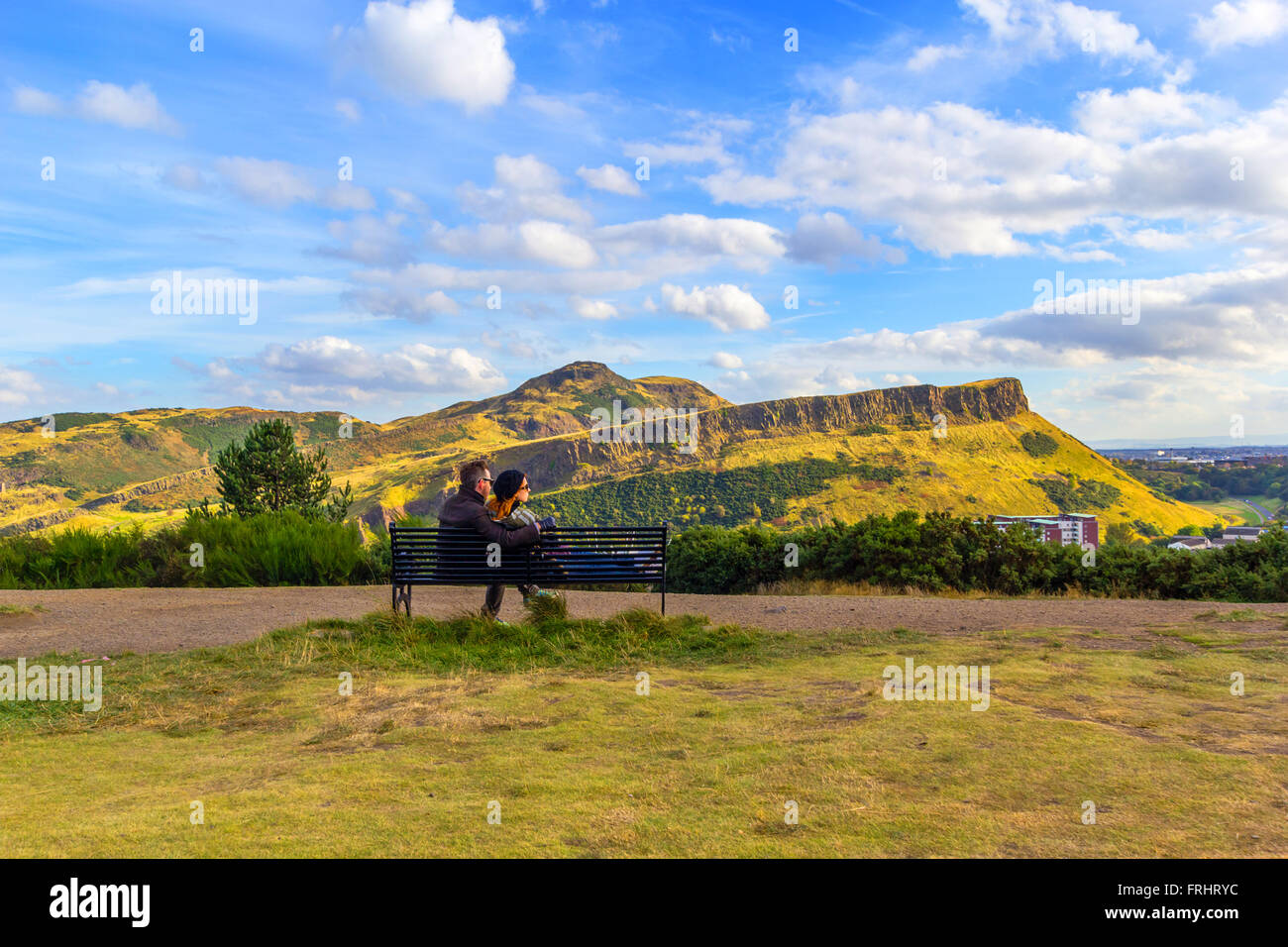 A Young Couple Sitting On The Bench At Carlton Hill Edinburgh