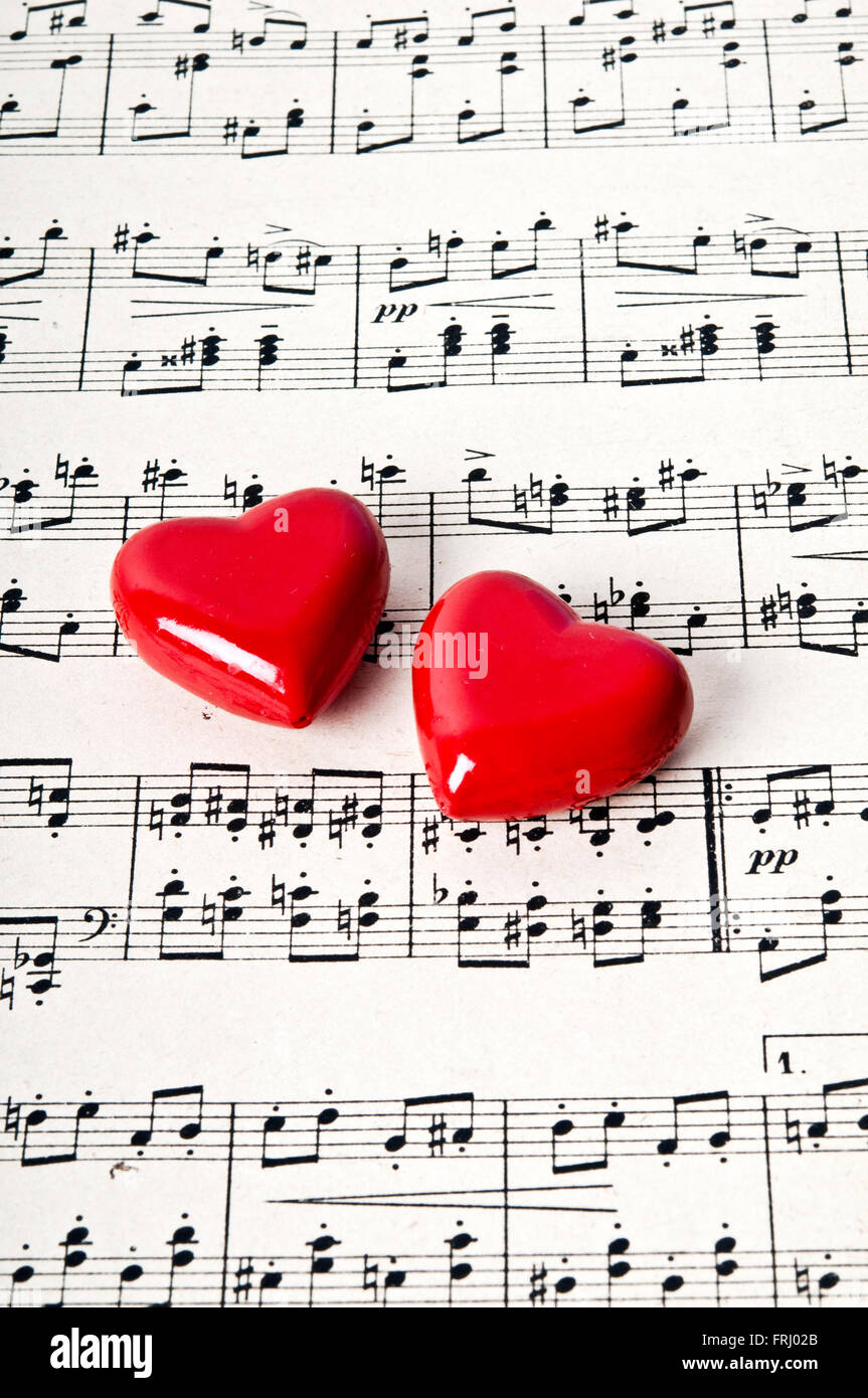 valentine hearts and score of music, love for music concept Stock Photo