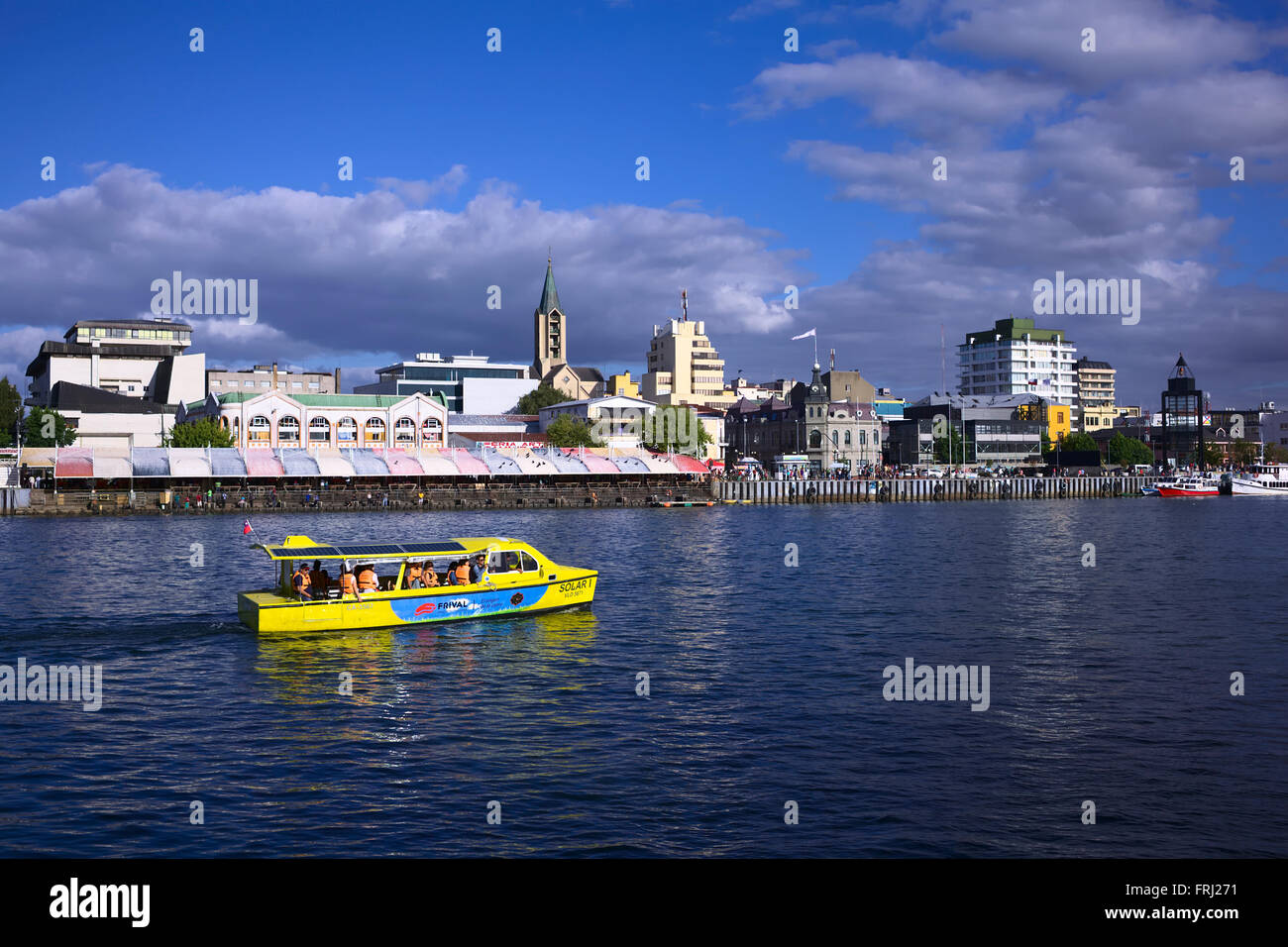 VALDIVIA, CHILE - FEBRUARY 3, 2016: Solar tour boat with view onto the Feria Fluvial (fish, vegetable and fruit market) Stock Photo