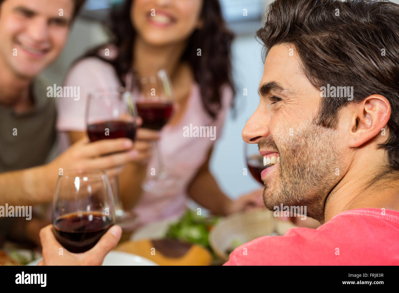 Man holding up red wine glass hi-res stock photography and images - Alamy
