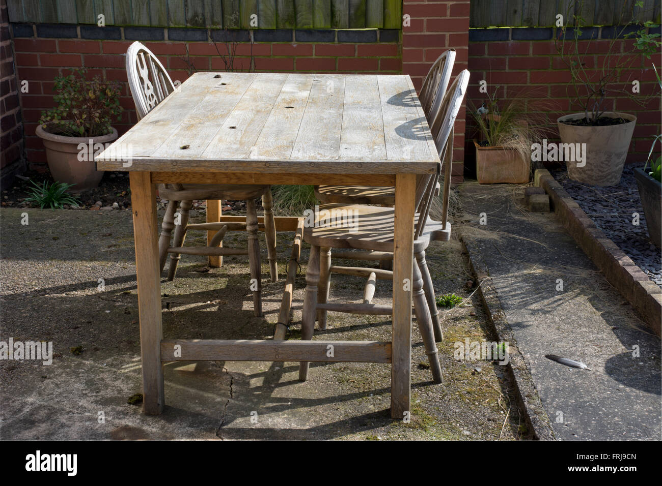 Old wooden table and chairs Stock Photo