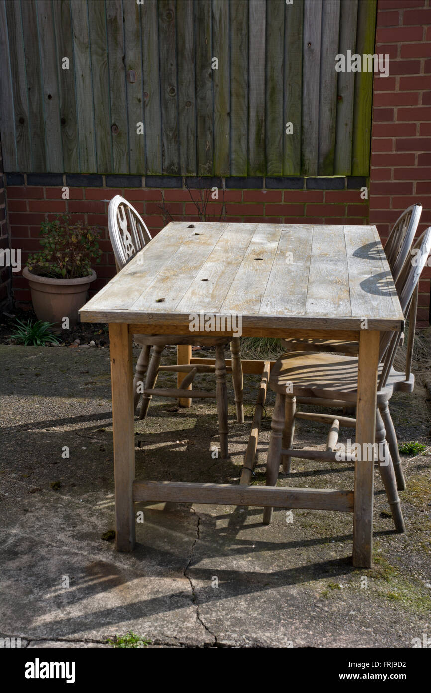 Old wooden table and chairs Stock Photo