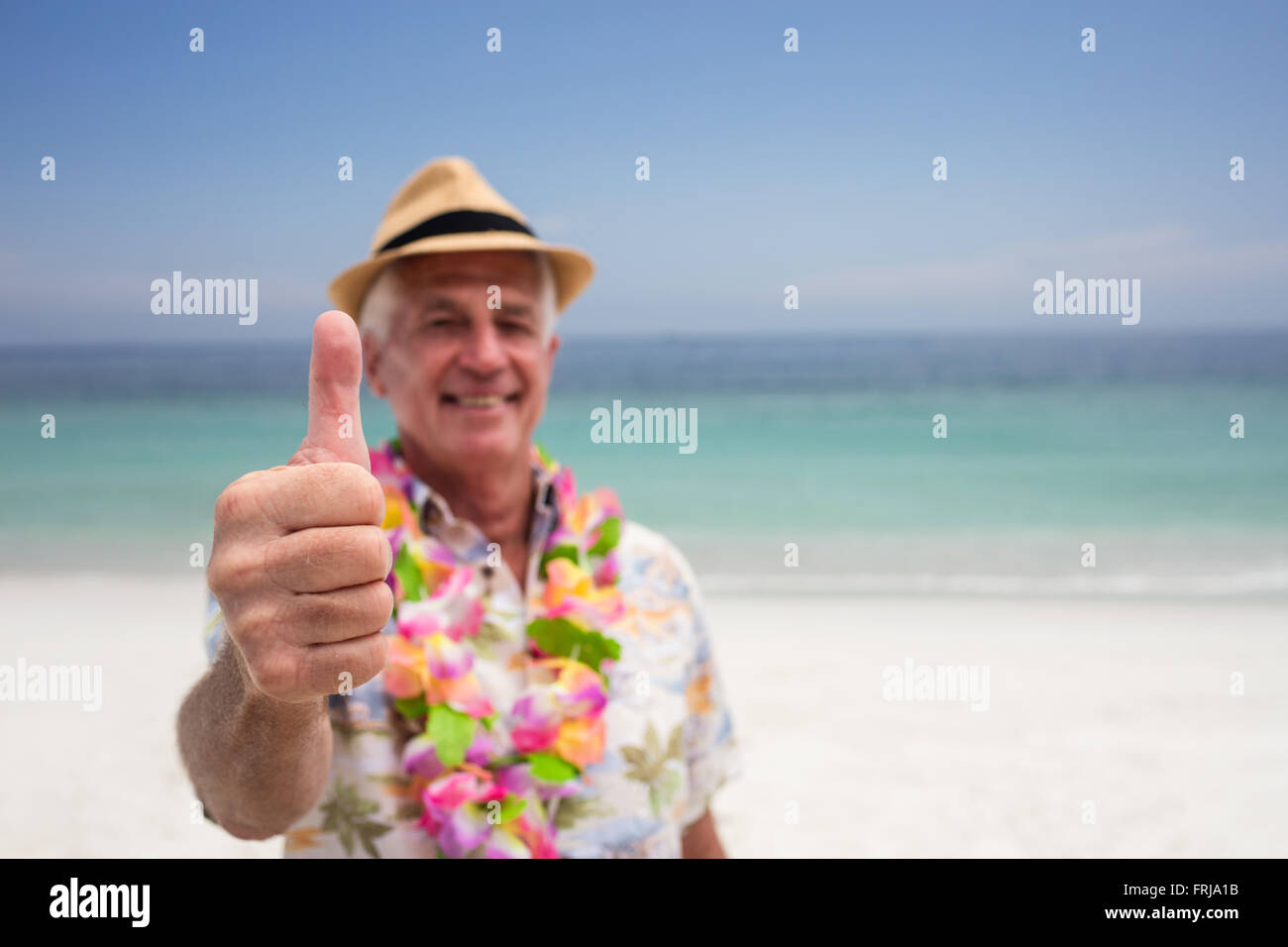 Happy senior man showing is thumbs up Stock Photo