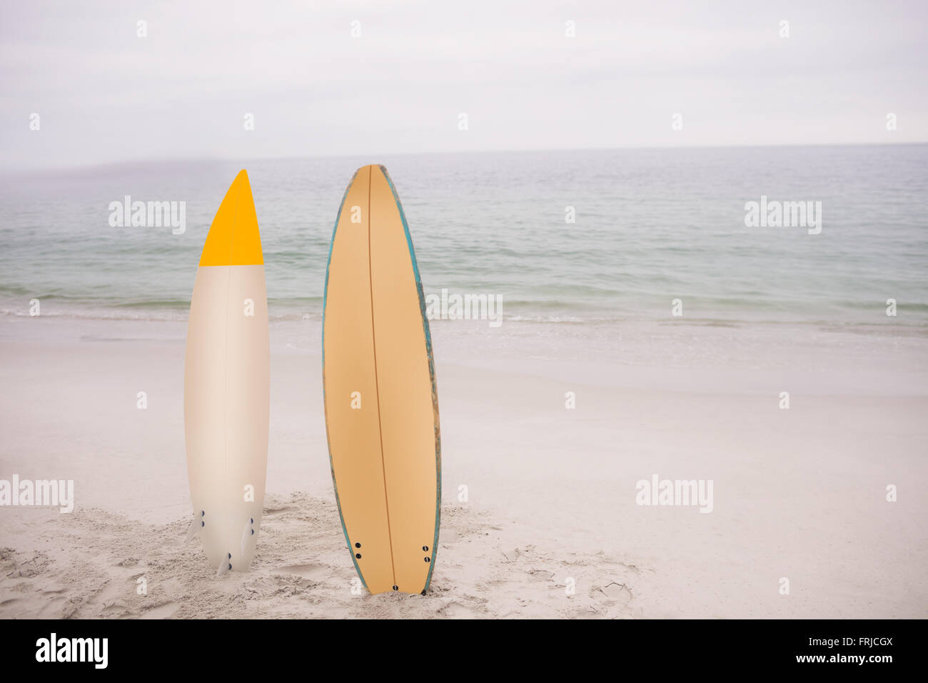 Two surfboard standing in sand Stock Photo Alamy